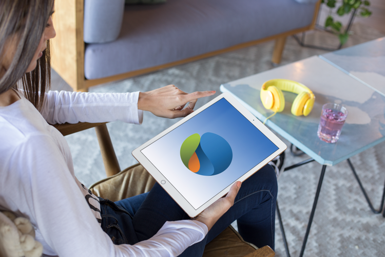 Ipad Pro Mockup Of A Girl Sitting In A Living Room 24791